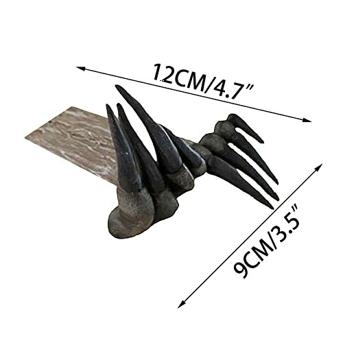 Claw-shaped door stopper with dimensions 12cm by 9cm.