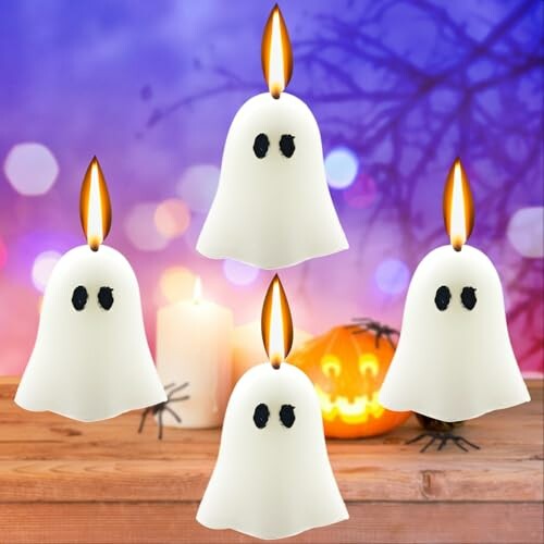 Four ghost-shaped candles with flames, Halloween theme.
