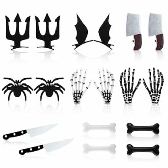 Halloween-themed cake toppers including tridents, bat wings, cleavers, spiders, skeleton hands, knives, and bones.