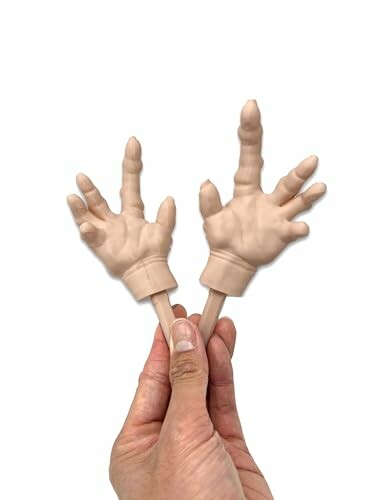 Two small novelty hand toys held between fingers.